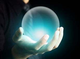 Hand of a business man holding a crystal ball glowing aqua blue