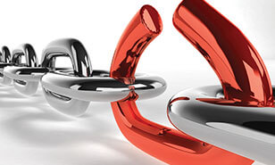 large, shiny metal chain links, one of which is red and pulling apart