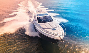 speed boat cruising through blue water at high speed