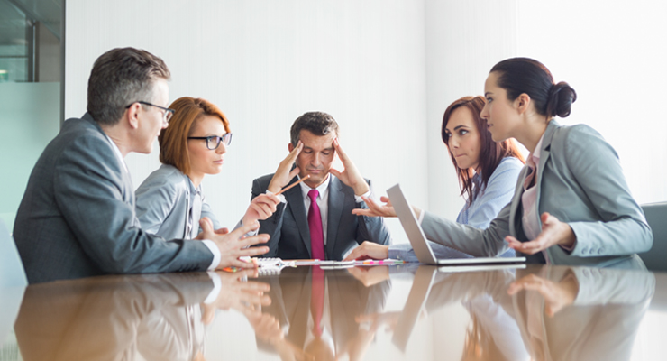 People arguing at conference table