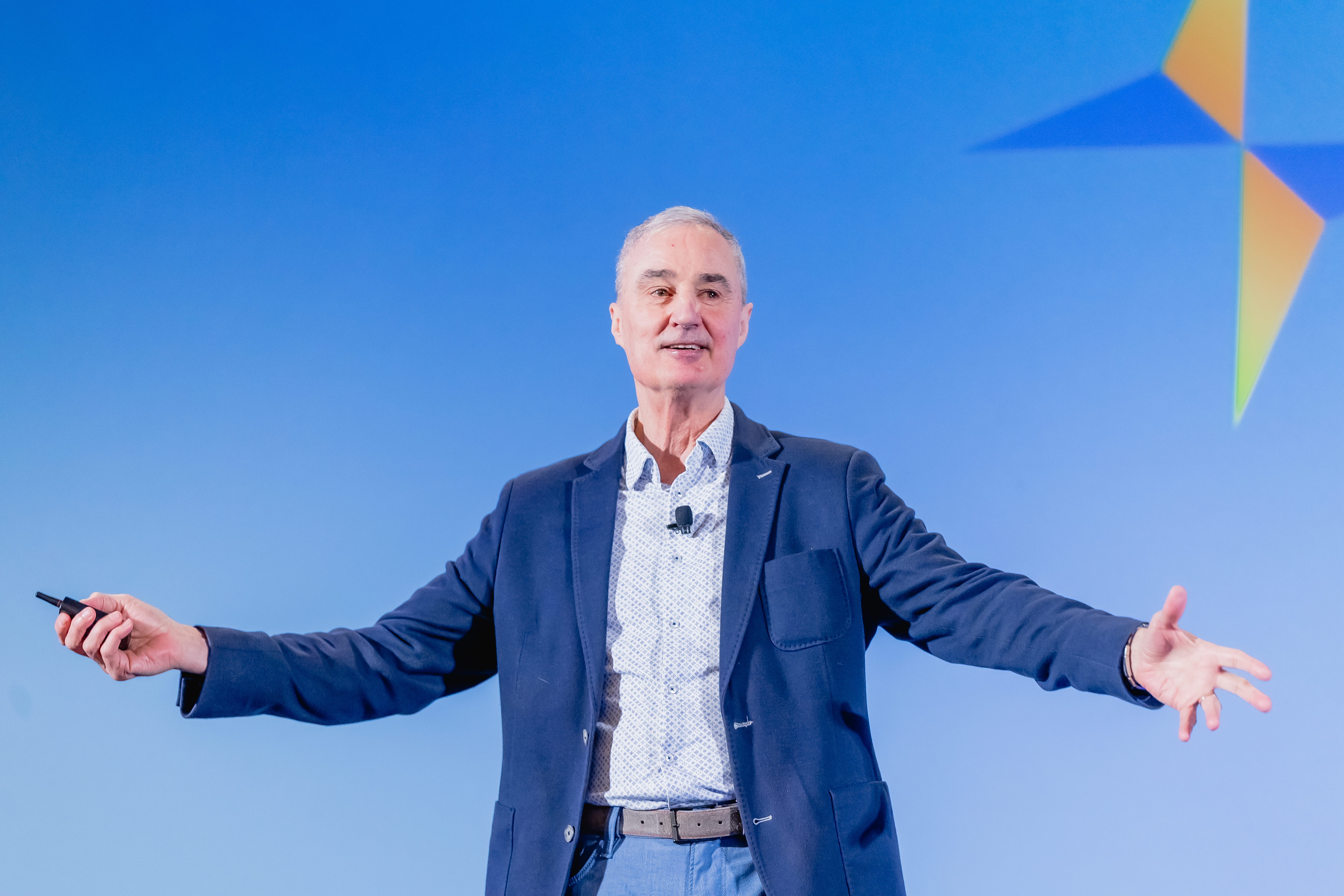 Speaker on stage at conference