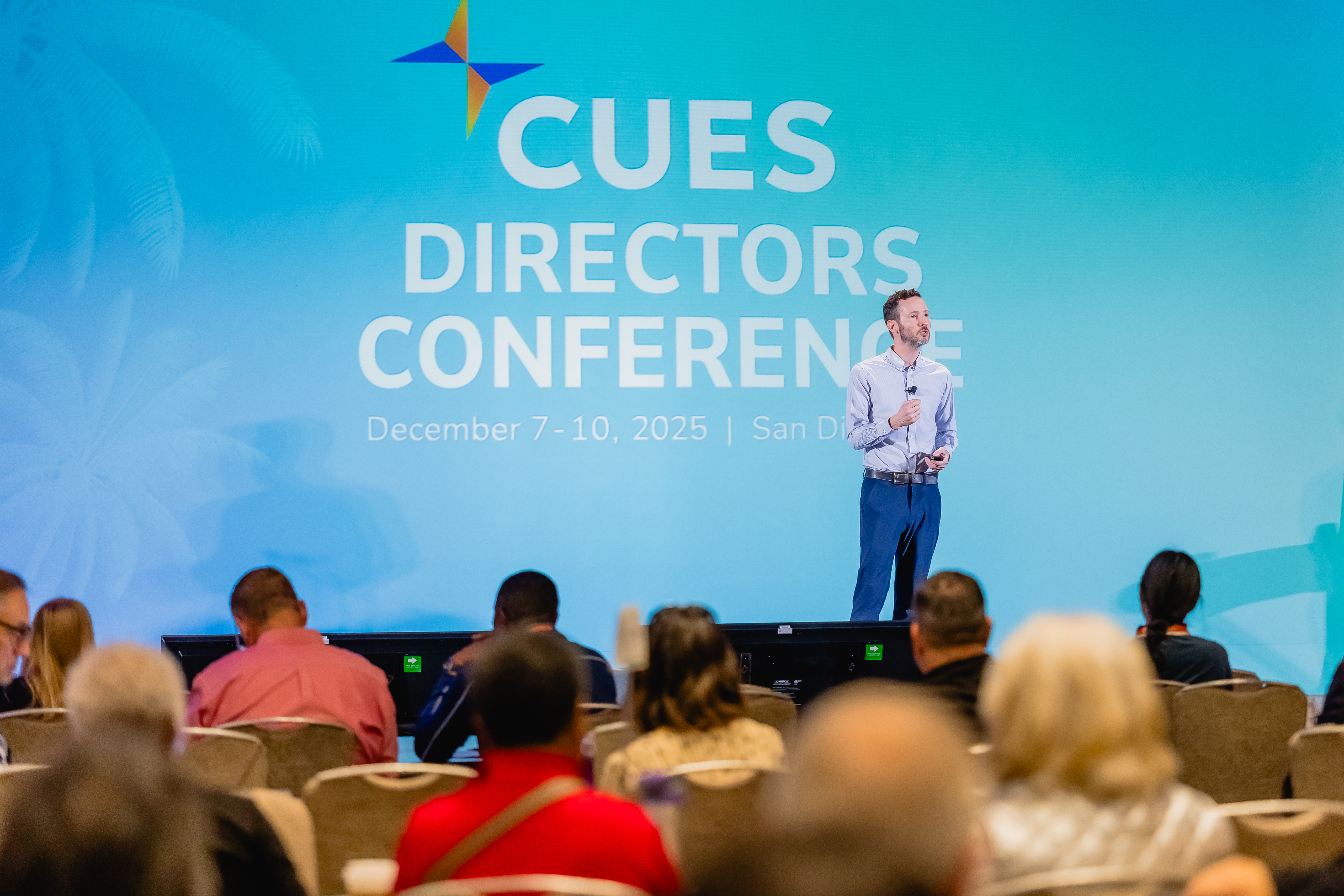 Speaker on stage at conference