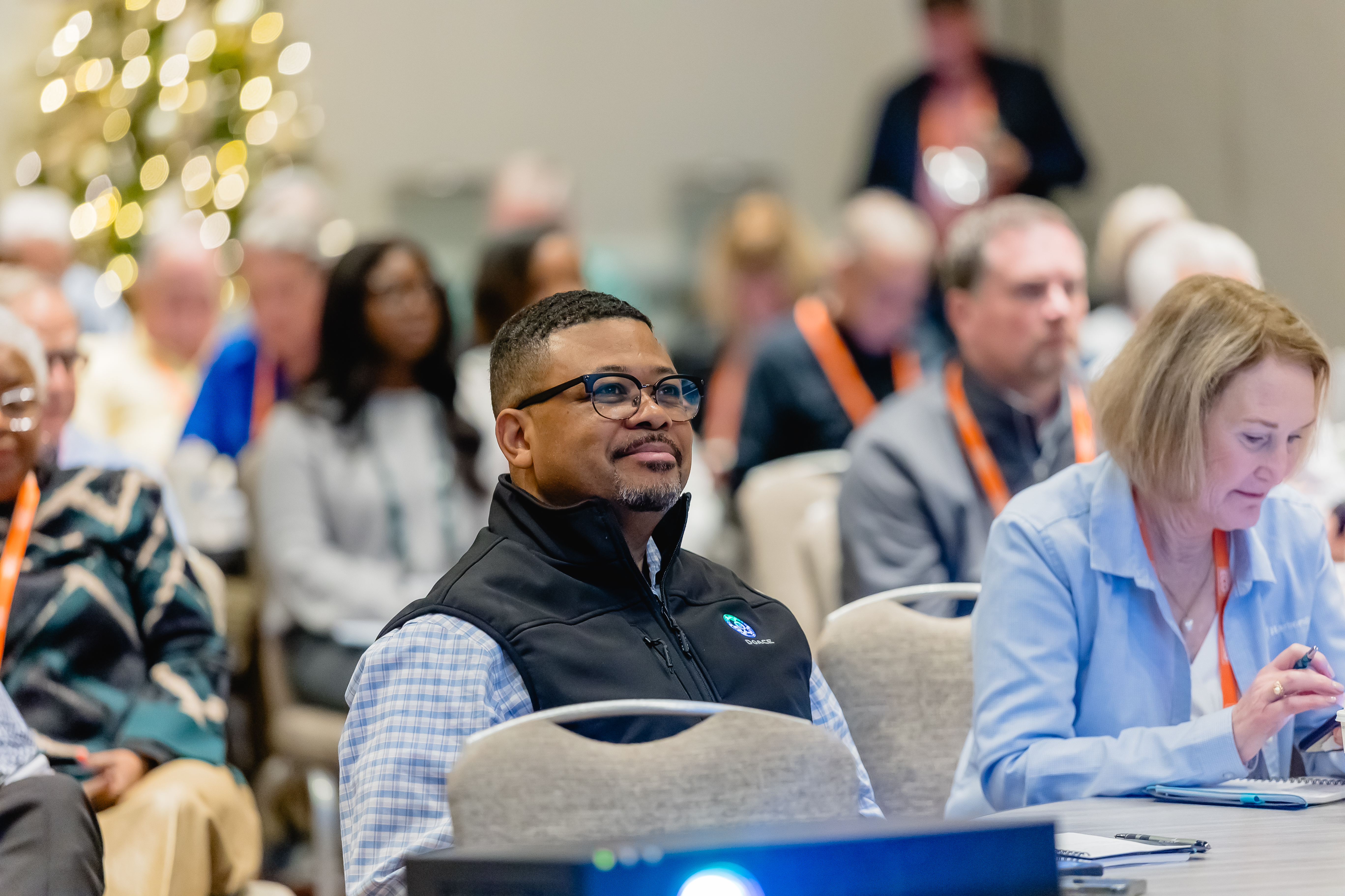 Attendee listening attentively to talk at conference