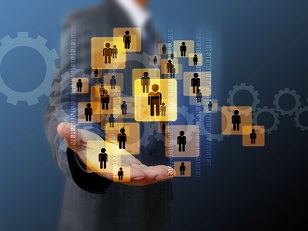 Business leader with array of people icons floating above his hand while he searches for the right person