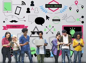 Group of Generation Z members using mobile devices, standing in front of a wall of illustrations depicting social media, trends and technology