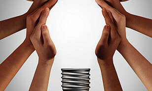 hands come together to form a lightbulb
