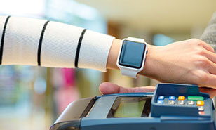 Customer using smartwatch to pay the bill by NFC technology