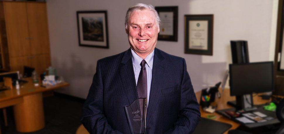 2020 Outstanding Chief Executive Garth Warner holding his trophy