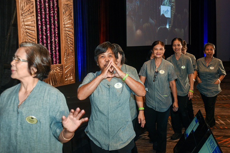 Luke Yurek, Hyatt Regency Maui Director of Rooms, and hotel staff affected by the Maui wildfires join CUES CEO Heather McKissick during CUES Directors Conference 2023 to receive donations given through The Gift Card Drive. 