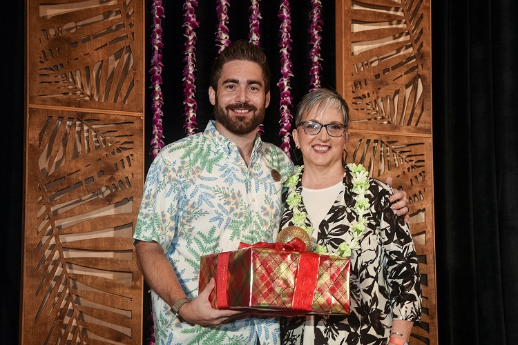 Luke Yurek, Hyatt Regency Maui Director of Rooms, and hotel staff affected by the Maui wildfires join CUES CEO Heather McKissick during CUES Directors Conference 2023 to receive donations given through The Gift Card Drive. 